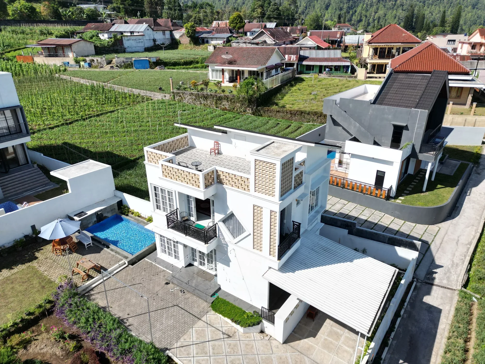 property and surrounding context photographed from an aerial drone perspective